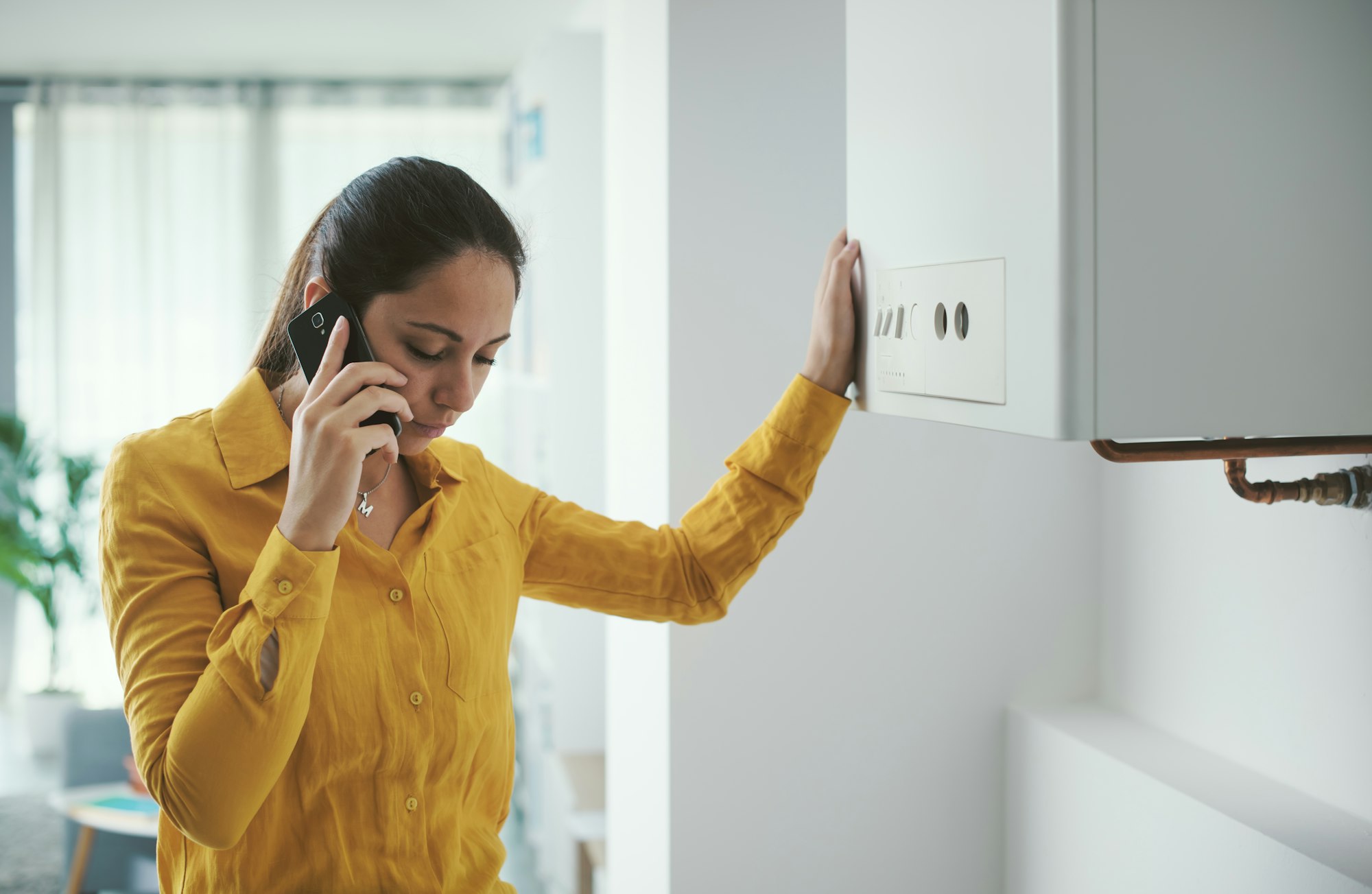 Woman calling a boiler breakdown service